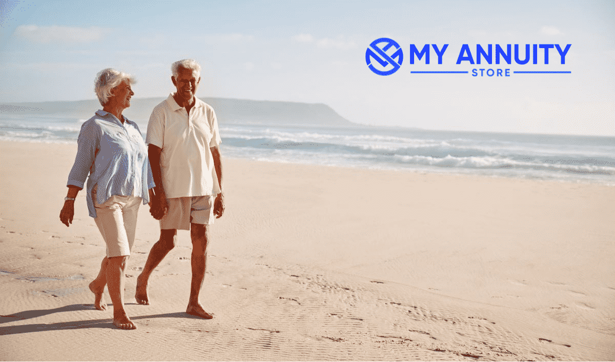 Retired couple walking on beach