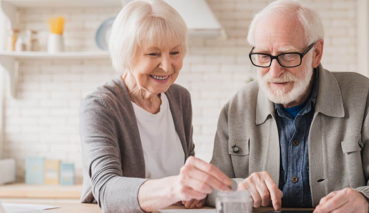 Free Look Period a grey haired retired couple sitting at a table.